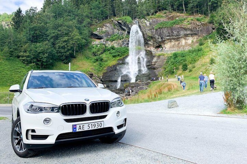 Car transport from Bergen to Norheimsund, with stop at Steinsdalsfossen waterfall