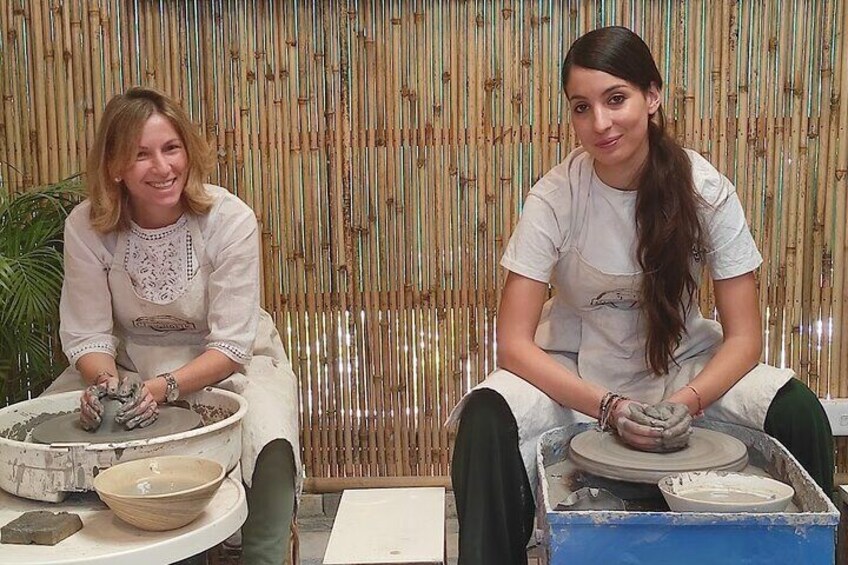 Guest doing wheel pottery workshop