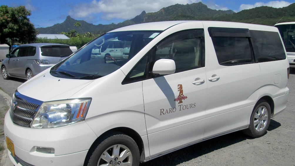 Tour van in parking lot on Cook Island