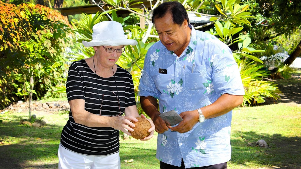Tourist with a guide on Cook Islands 