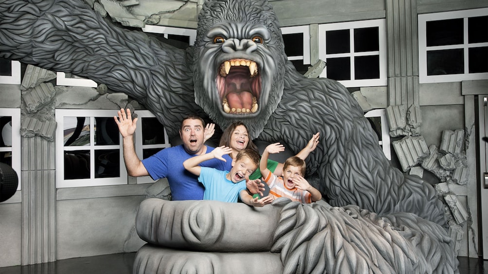 Family taking a photo with a fake gorilla at the Hollywood Wax Museum Entertainment Center in Myrtle Beach, South Carolina 