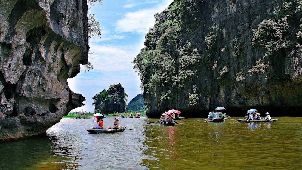 Boats floating down Tam Coc, Vietnam 