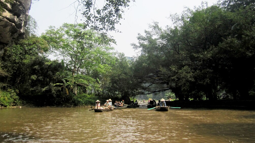 Serene view of visitors sailing down a river in Vietnam 