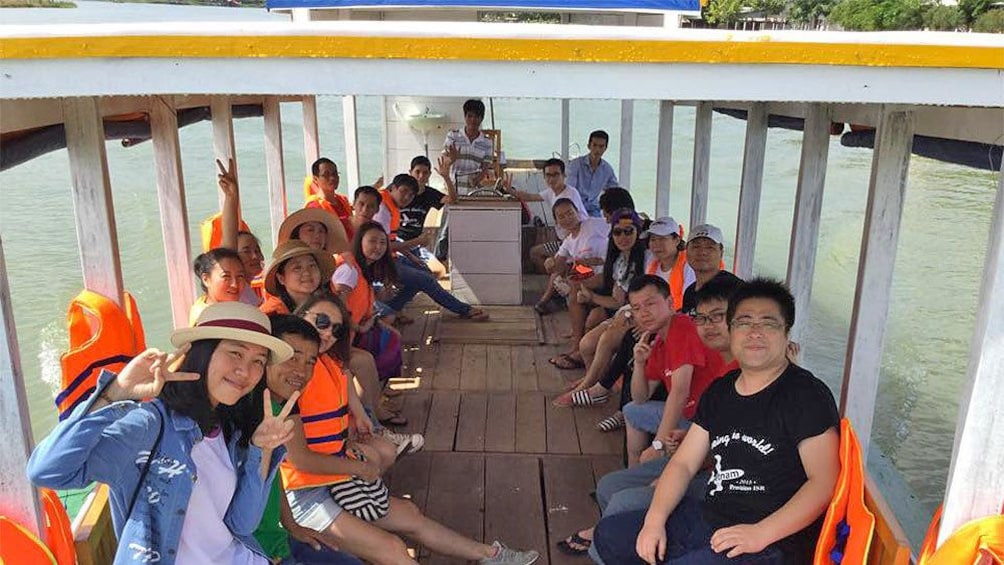 Boat view of tourists enjoying a scenic float in Hoi An, Vietnam