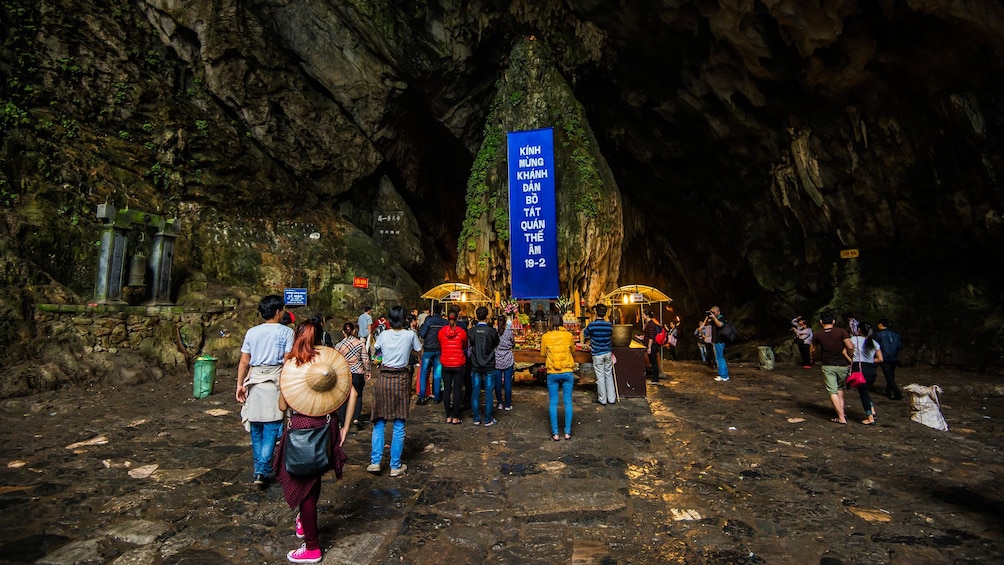 A tour group in a cave on the Perfume Pagoda tour