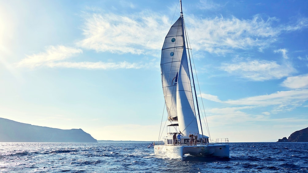 Catamaran sailing in Santorini