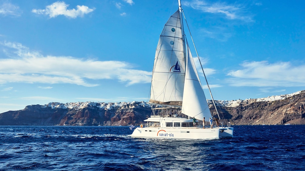 Catamaran sailing in Santorini