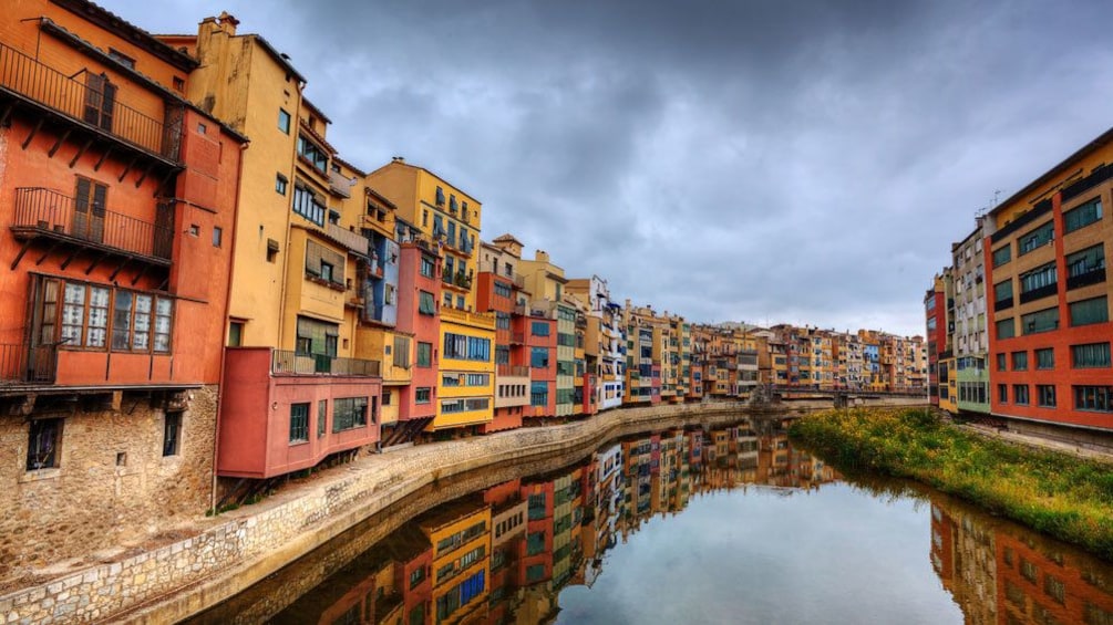 Canal with colorful buildings on either side in Costa Brava