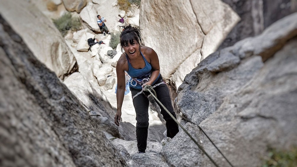 Show item 3 of 5. Rock climber on rock face in Ontario