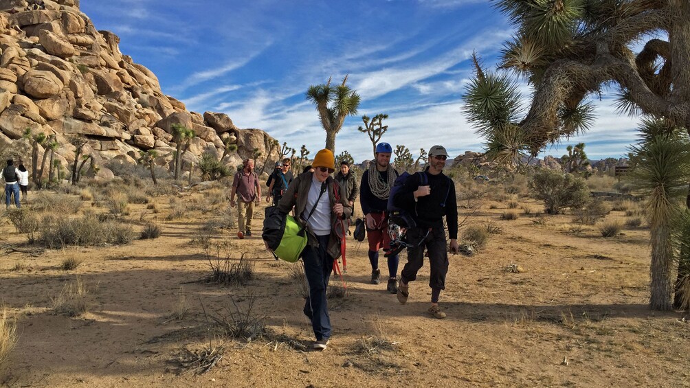 Show item 3 of 5. Rock climbers walking back in Palm Springs