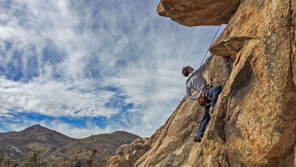 Show item 1 of 5. Rock climber climbing in Palm Springs