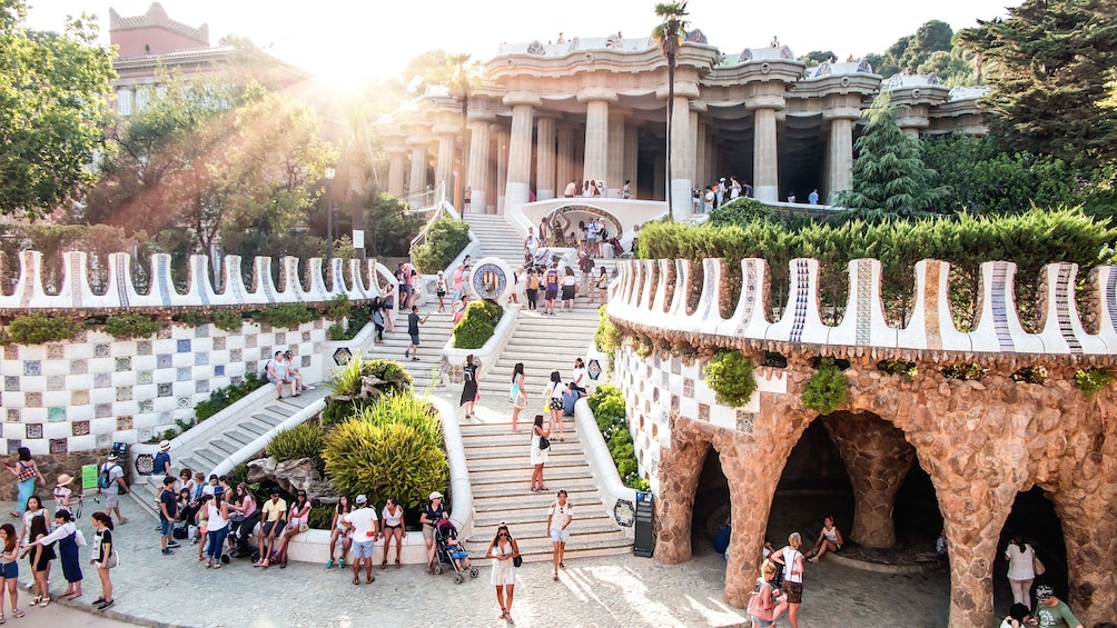 Several observers walking about Park Güell.