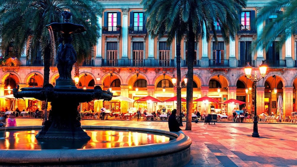 evening outdoor dining near a water fountain in Barcelona