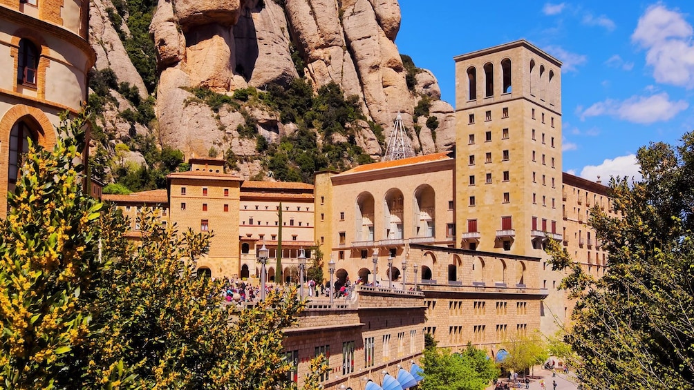 Santa Maria de Montserrat Abbey next to mountain walls in Barcelona