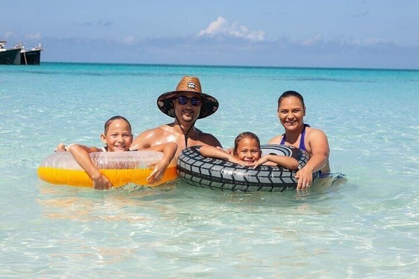 Family enjoying their time at Rose Island beach.