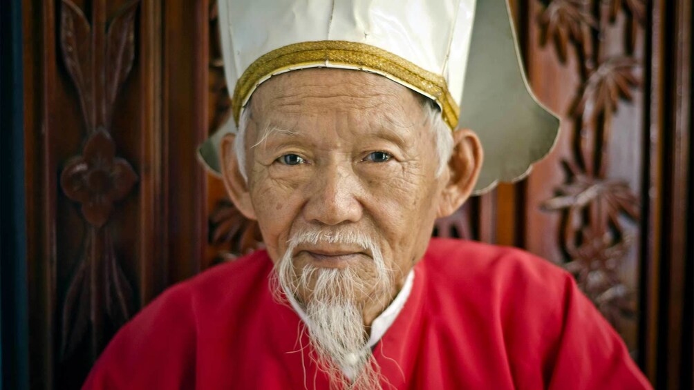 Old man at the Cao Dai Temple in Vietnam 