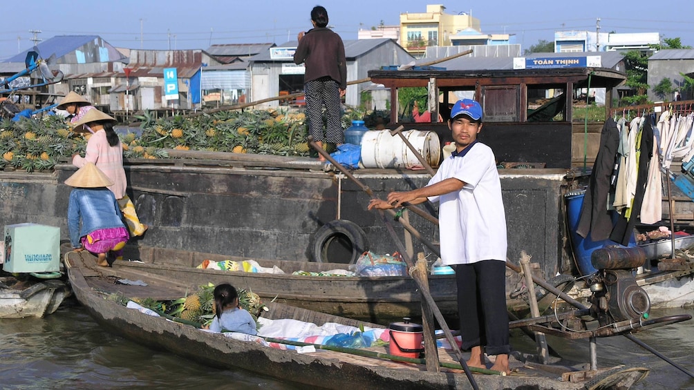 Locals getting ready to float their boat down the Mekong River in Vietnam 