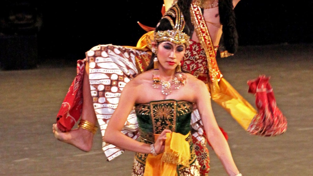 woman in traditional costume on stage in Indonesia