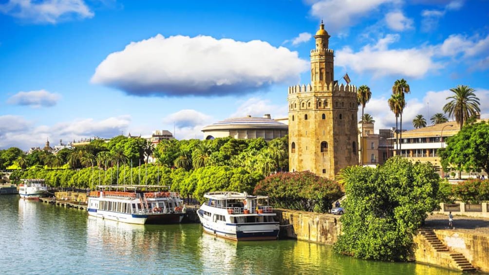 Guadalquivir River with several boats in view.