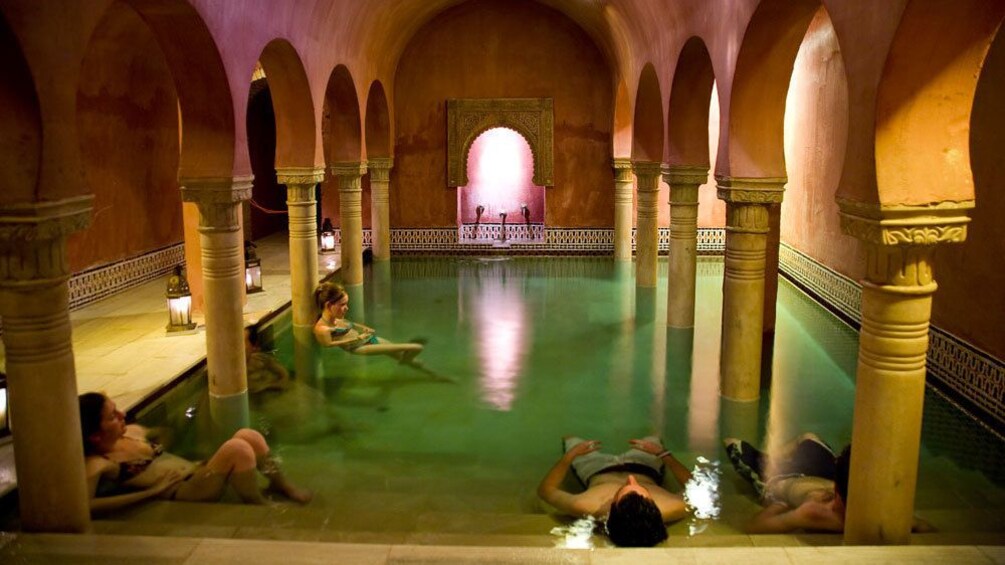 People relaxing in a bath in Granada