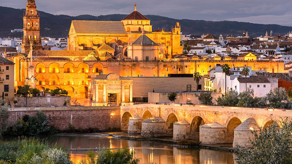 Landscape of Guadalquivir river area with several buildings in view.