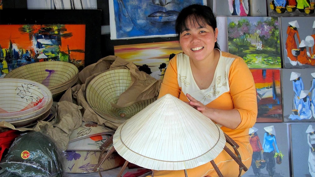 Woman crafting hats in Hanoi