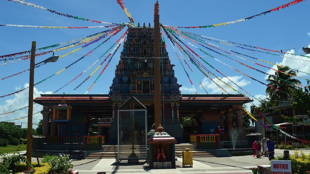 Temple with colorful streamers coming down from the roof in Fiji