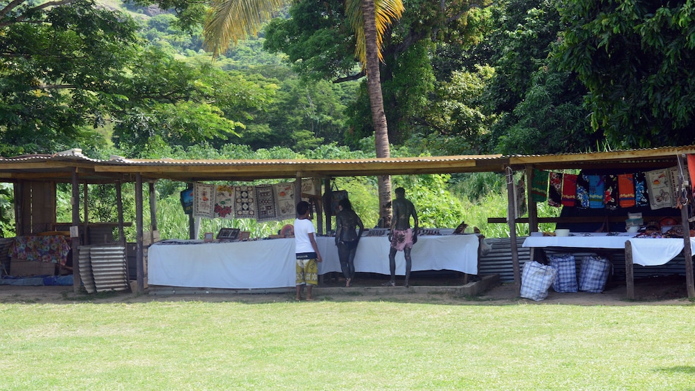 Stalls with colorful local textiles in Fiji