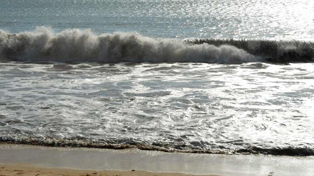 Waves crashing on the beach in Fiji