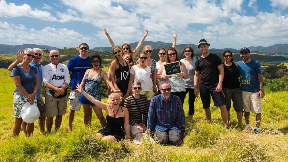 Group taking a photo on the Bay of Islands tour in New Zealand