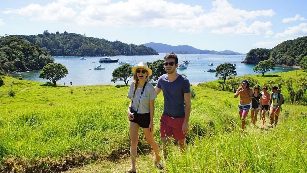 Group walking on the Rock Day Cruise tour in the Bay of Islands, New Zealand