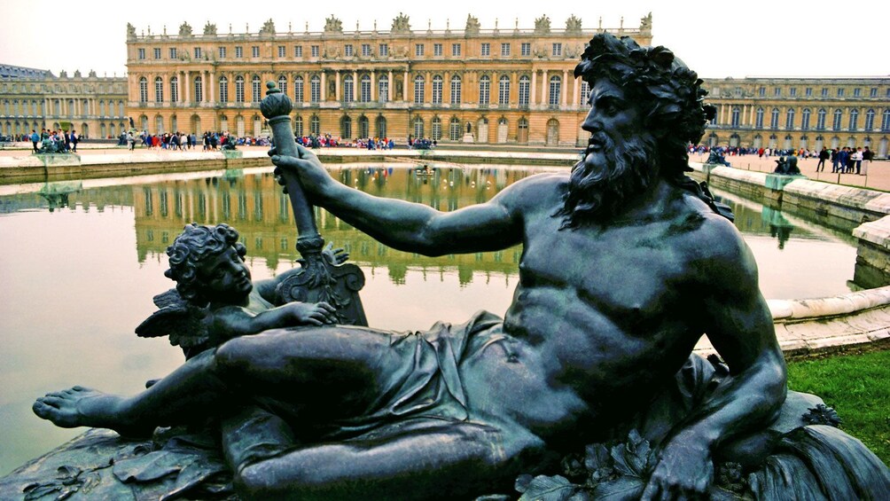 sculpture at the fountain outside of the Versailles Palace in France