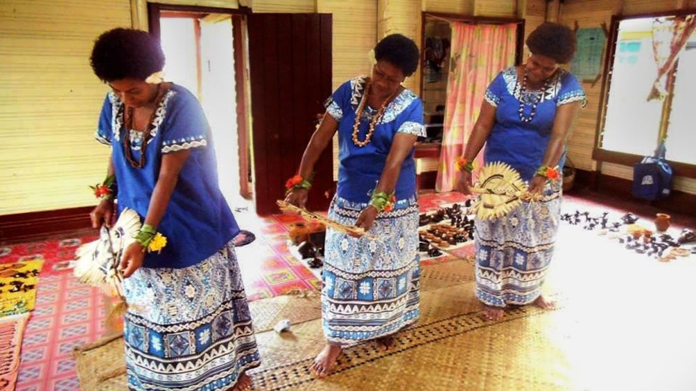 Women in traditional costumes dancing in Fiji