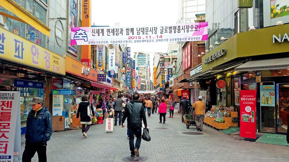 street crowded with shoppers in Korea