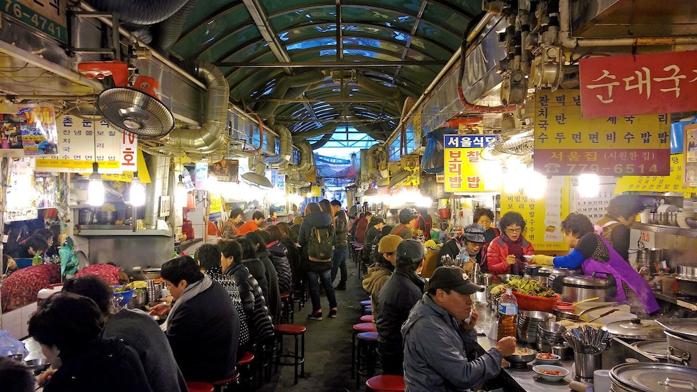 patrons dining at the street market in Korea