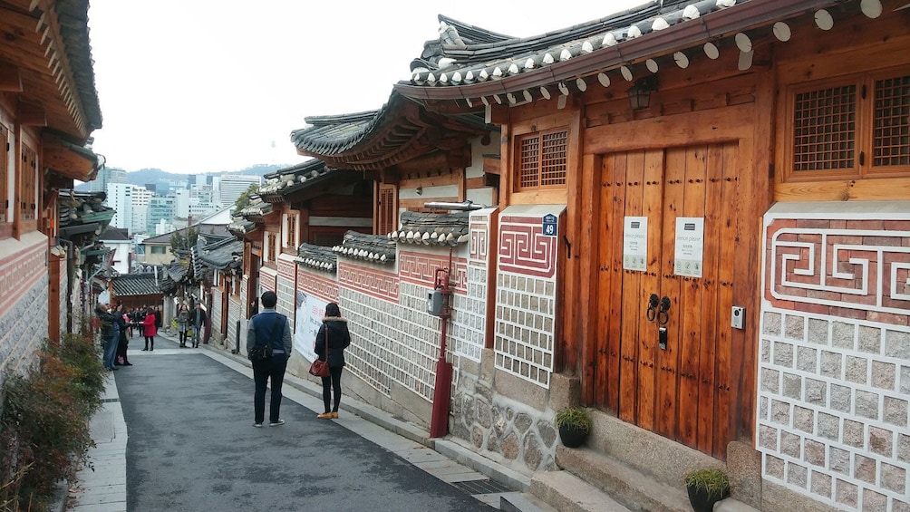 walking down a narrow street in Korea