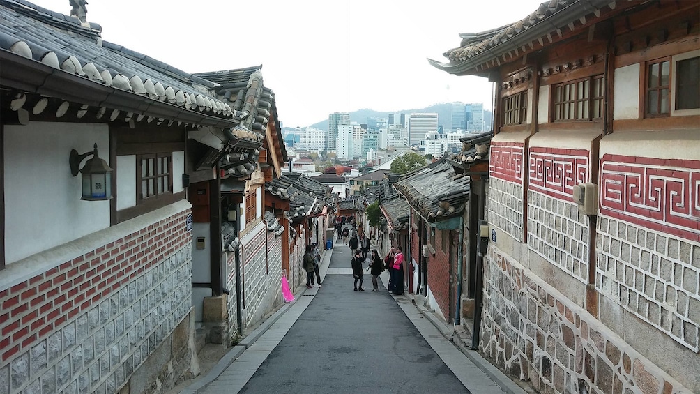 Tourists visiting the Bukchon Hanok Village & Bukaksan Fortress in Seoul, South Korea