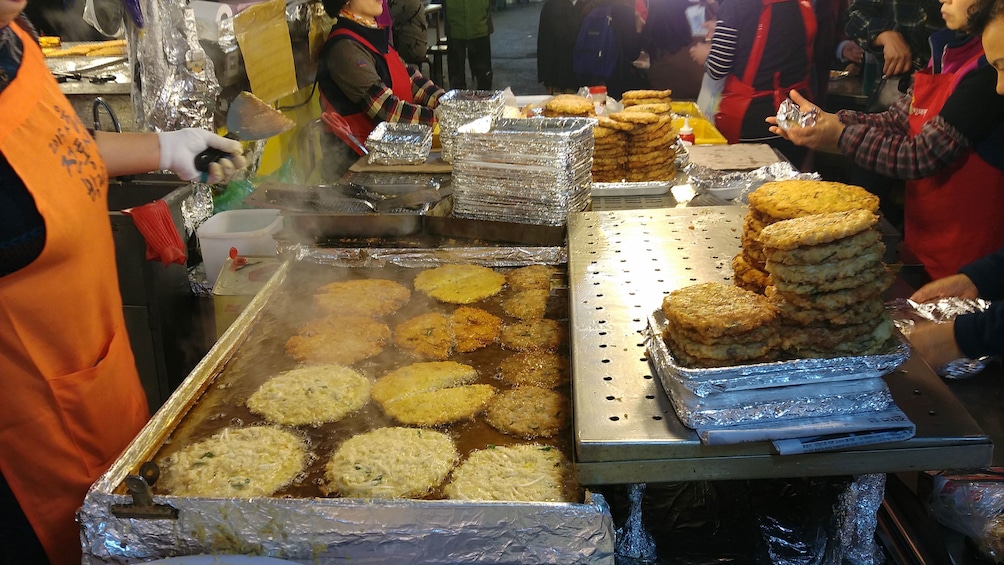 deep frying patties at market