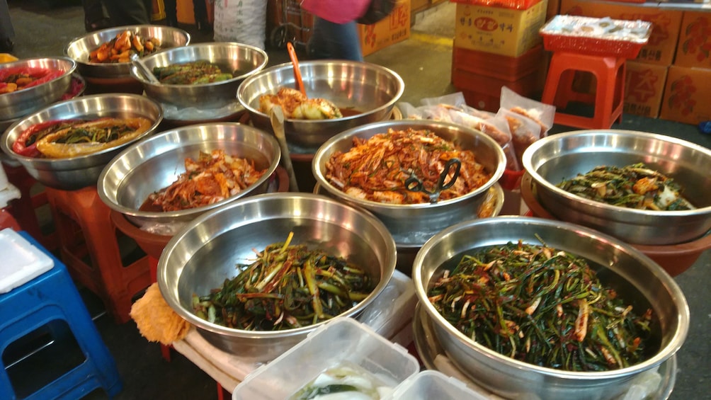 large bowls with kimchi and other foods