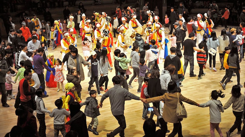 people dancing in large group