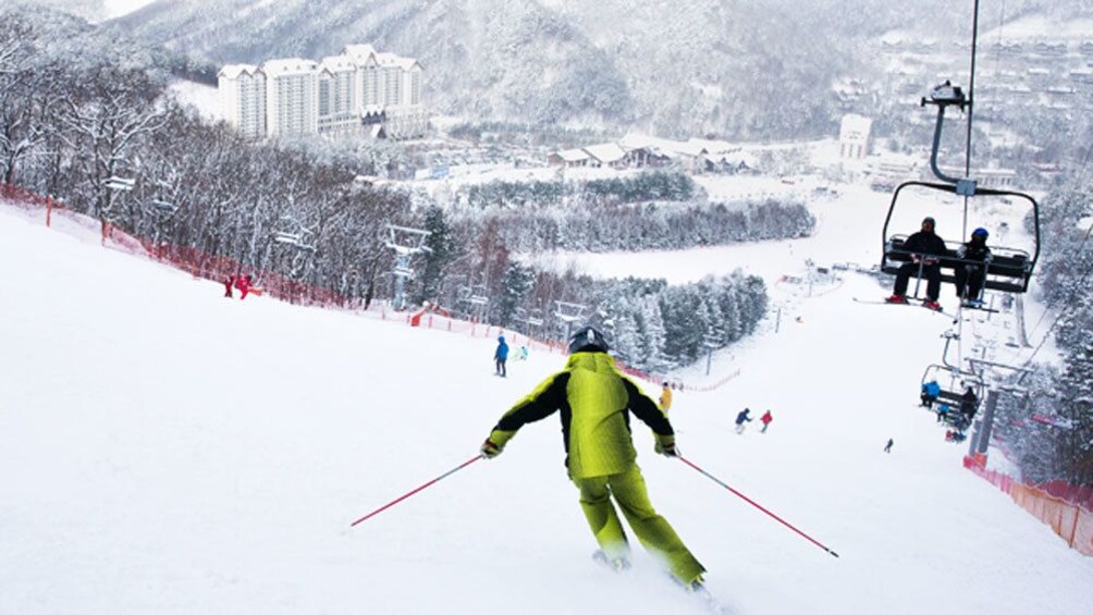 skier in yellow suit 