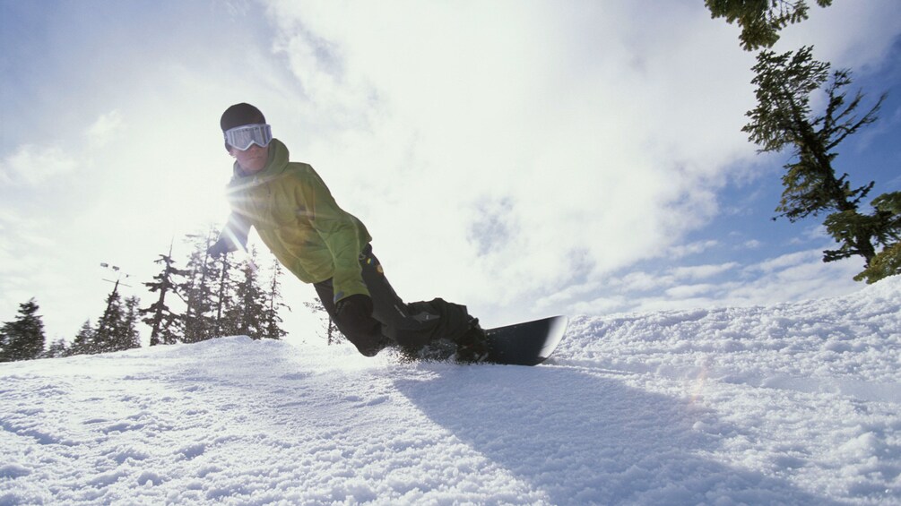 Snowboarding man on the slopes in Salt Lake City