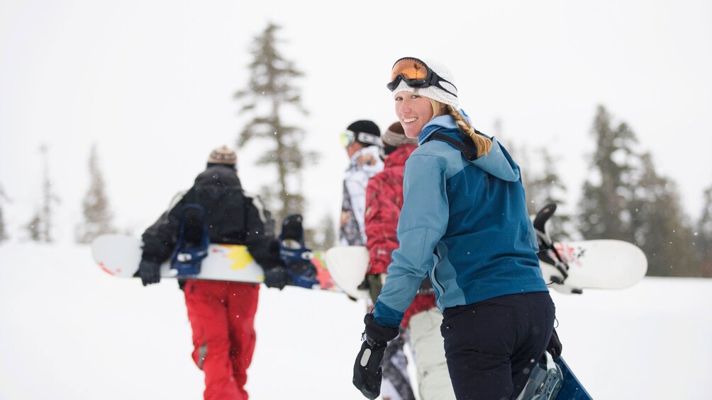 Group walking with snowboards in Salt Lake City