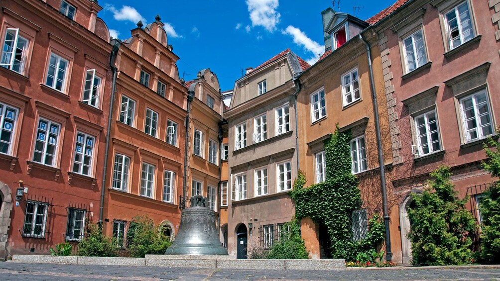 a historic bell monument outside in Warsaw