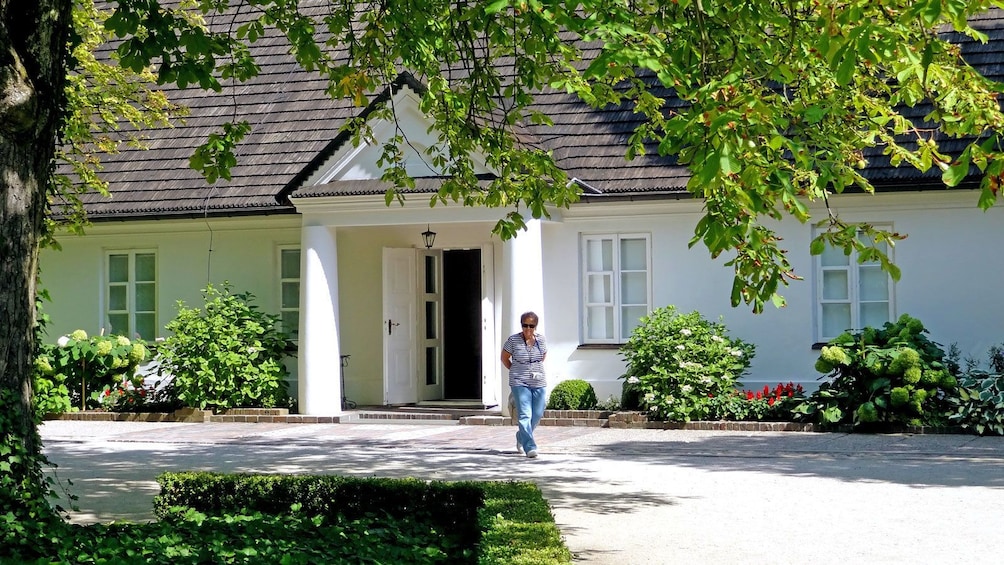 woman walking near the entrance to a museum in Poland