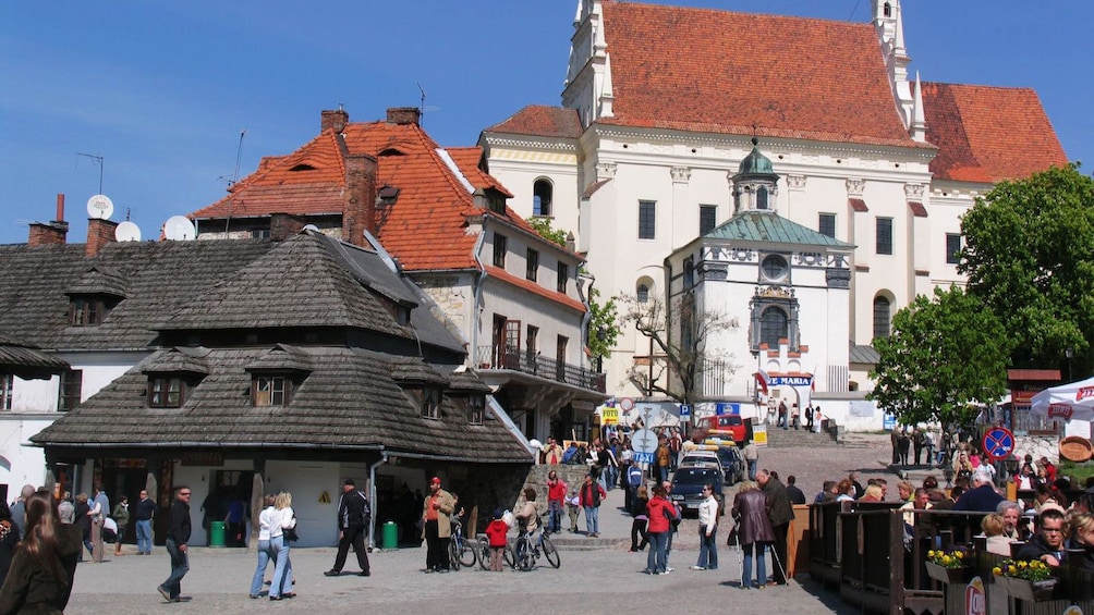 People walking through market square in Kazmiriez Dolny