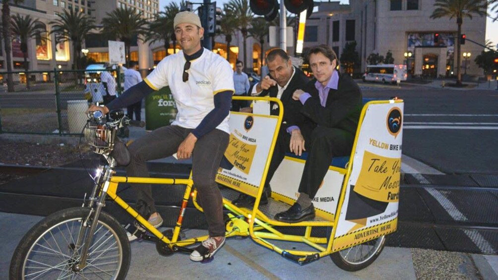 View of tourists observing city from pedicab.