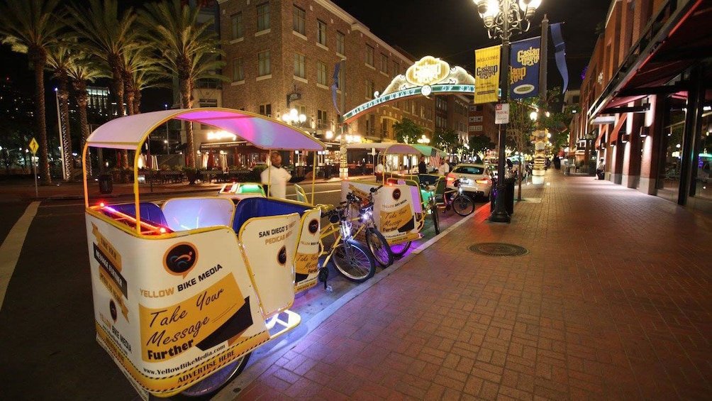 Pedicabs parked at night in San Diego