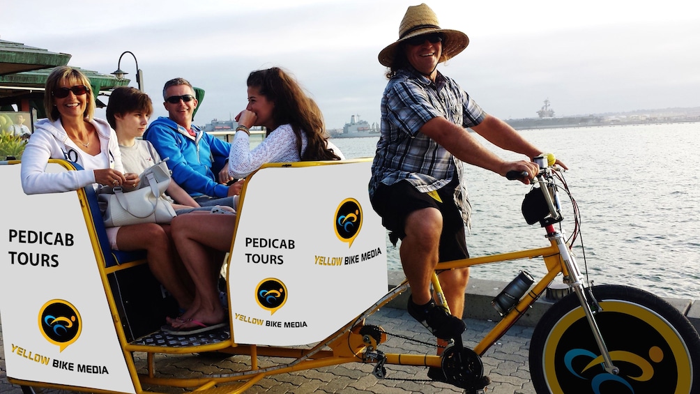 Tour group in a pedicab along the coast in San Diego
