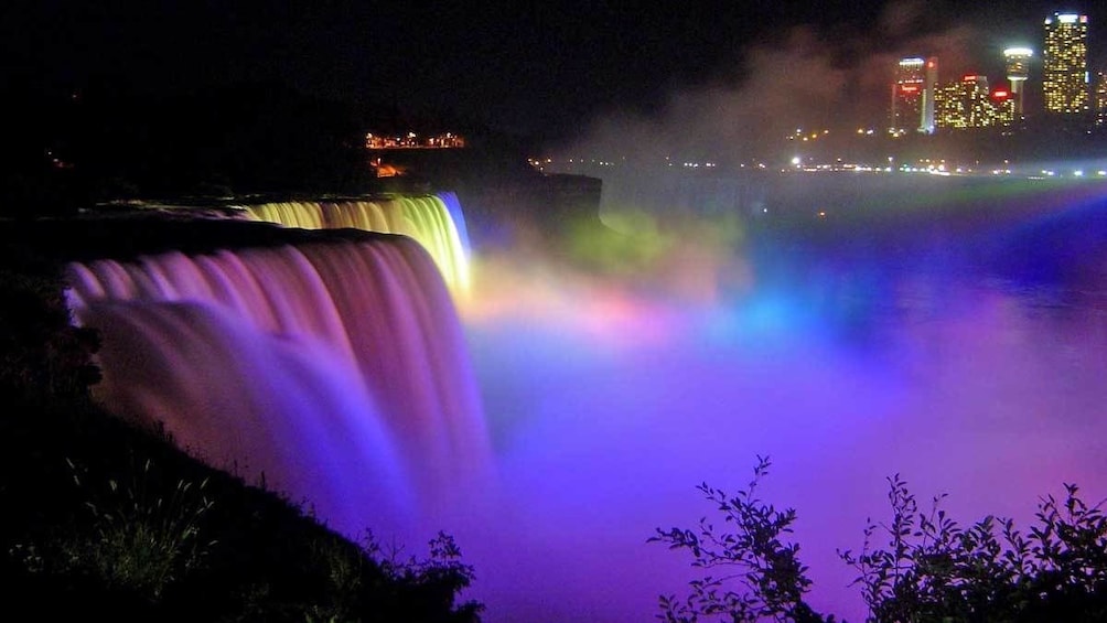 colorful illuminated water fall at Niagara Falls